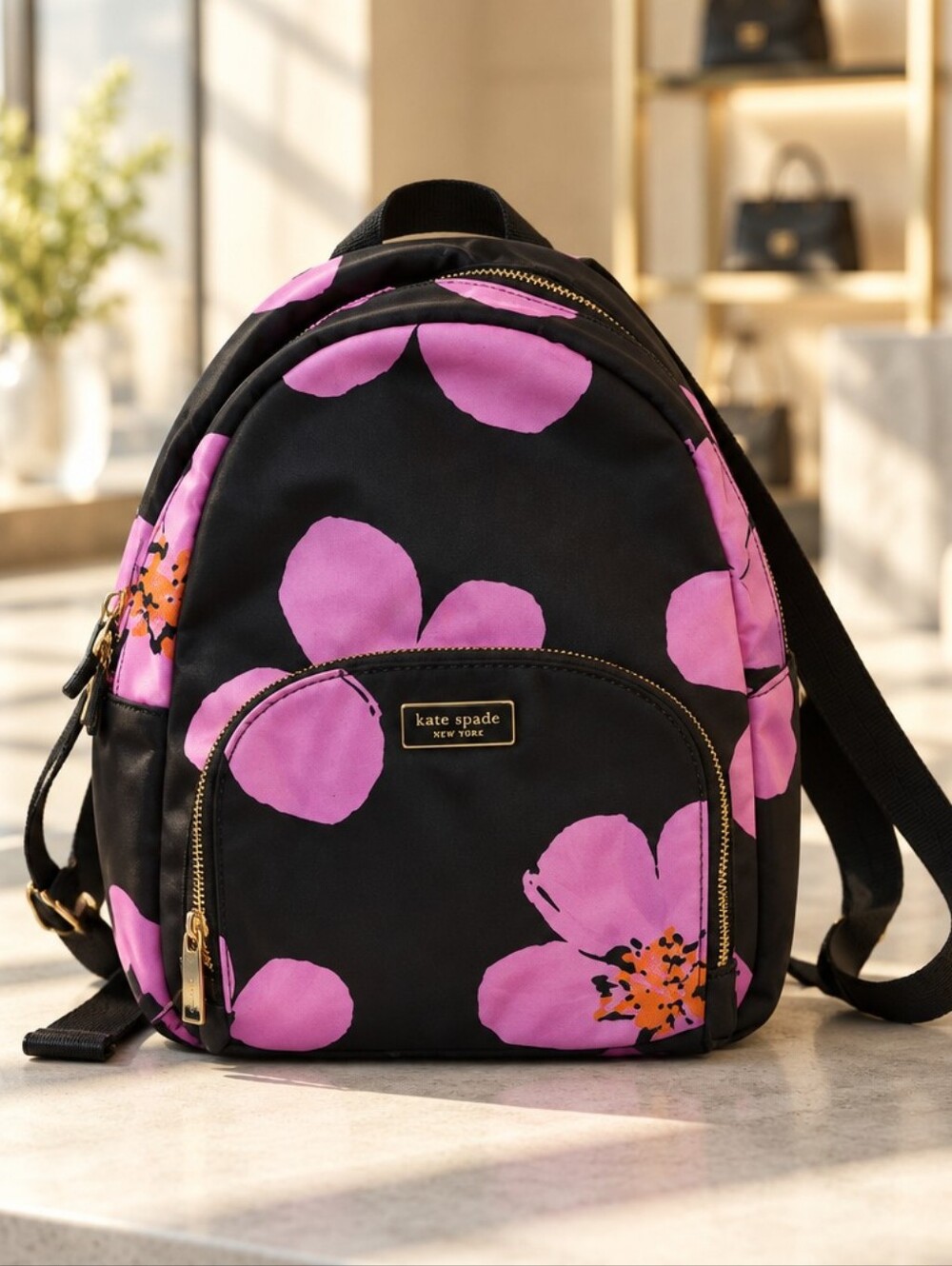 kate spade black backpack with pink floral print EUC